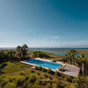 ***Maisons face à la lagune avec piscine***